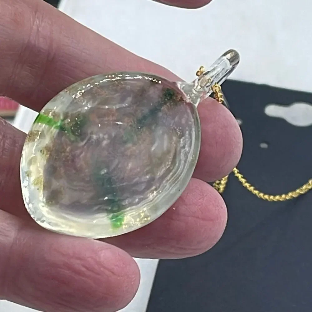 Floral art glass pendant on a 925 plated gold chain.